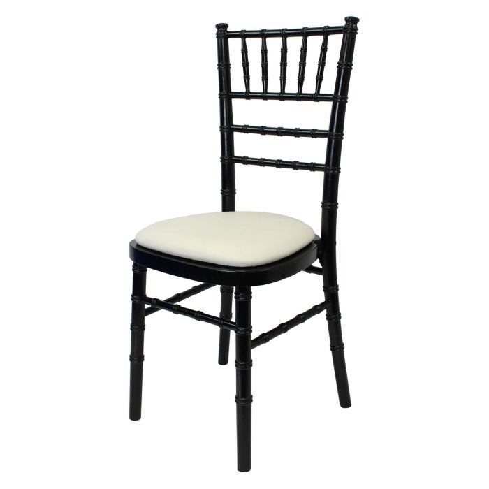 Profile view of black Chiavari chair with ivory pad