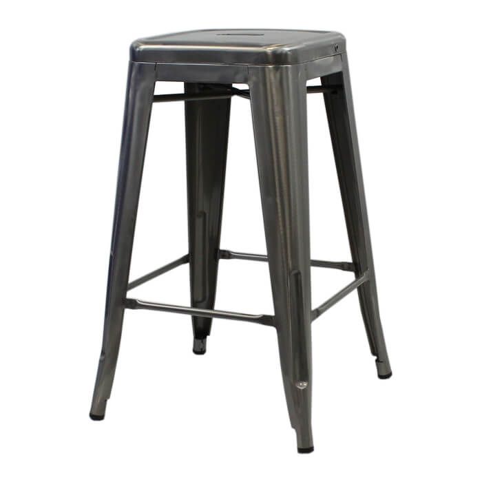 Profile view of industrial grey Tolix breakfast stool