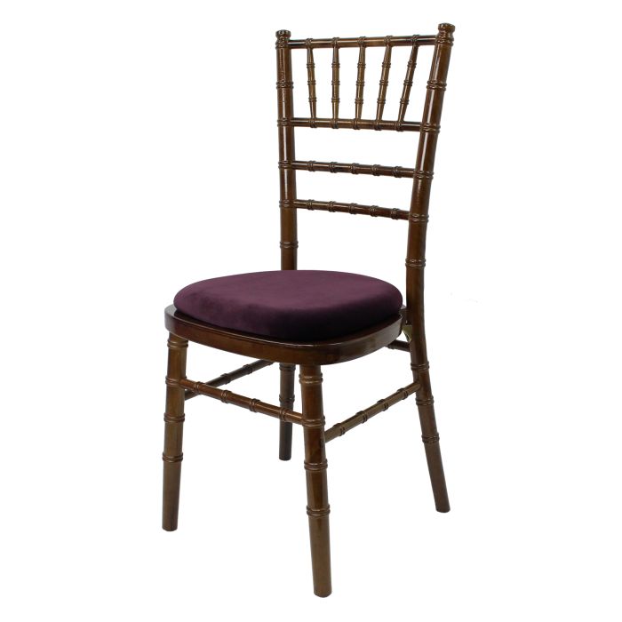 Profile view of walnut Chiavari chair with purple pad