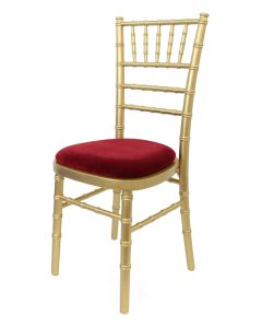 Profile view of gold Chiavari chair with red pad