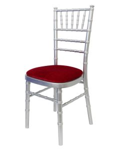 Profile view of silver Chiavari chair with blue pad