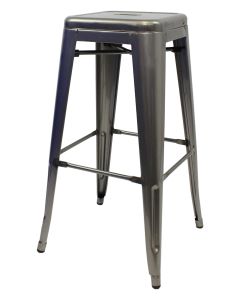 Profile view of industrial grey Tolix bar stool
