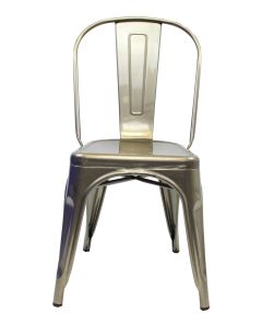 Profile view of industrial grey Tolix chair